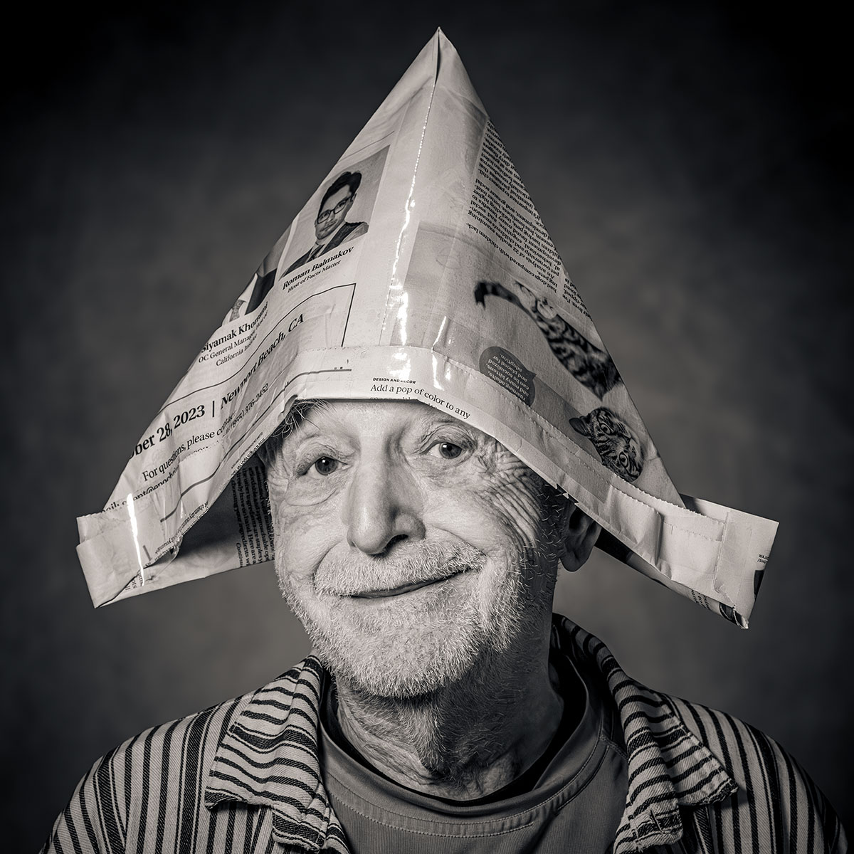 https://www.dodho.com/wp-content/uploads/2024/06/Jeff-Schewe-Duane-Michals-Wearing-His-Newspaper-Hat.jpg